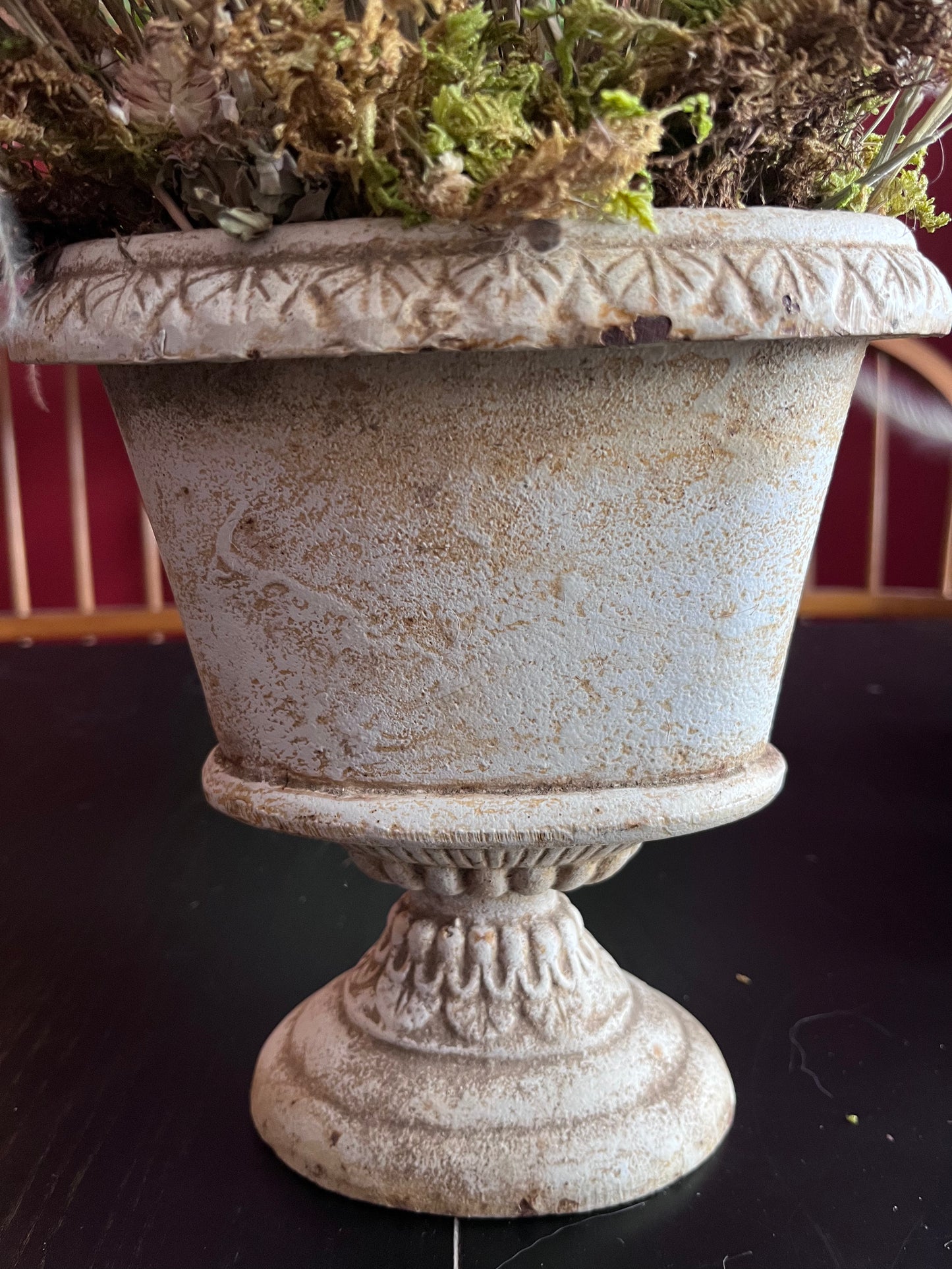 Dried arrangement in vintage cast iron urn